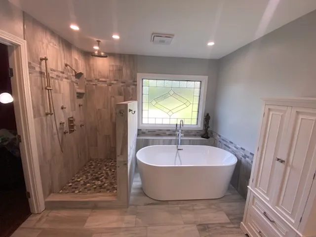 Shower and freestanding tub with wood-look tile