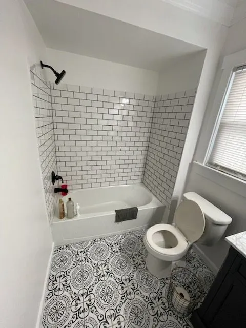 Subway tile bathroom with matt black fixtures