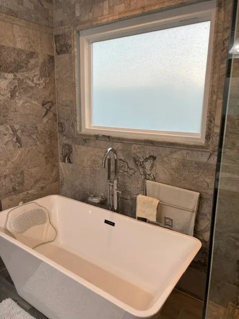 Tub set into a marble surround