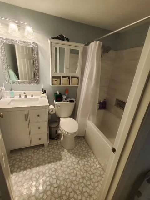 Bathroom vanity beside a tub