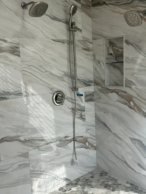 Heavily veined marble shower wall