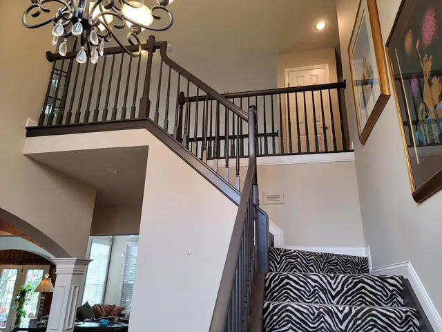 Stair hall seen from above with a patterned runner